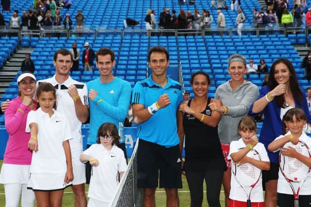 Tennis stars in attendance show off their 'Rally for Bally' wristbands. Picture: Getty