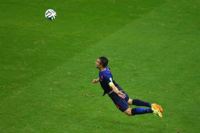 Robin van Persie leaps to score 'that' goal against Spain. Picture: Getty