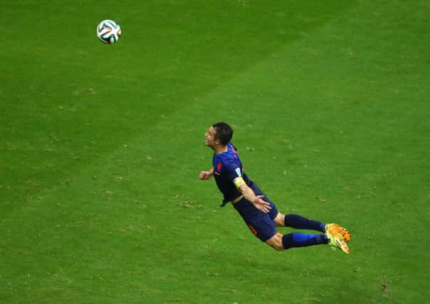 Robin van Persie leaps to score 'that' goal against Spain. Picture: Getty