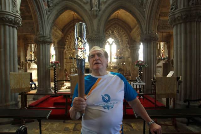 Actor Brian Cox carrying the Queen's Baton at Rosslyn Chapel, Midlothian. Picture: PA