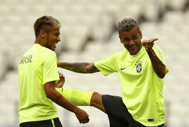 Dani Alves makes an amusing point to Neymar during a Brazil training session in Fortaleza. Picture: Reuters