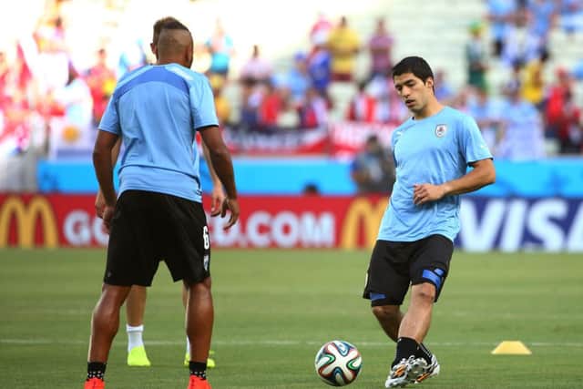 Luis Suarez, right, trains prior to Uruguay's game against Costa Rica. Picture: Getty