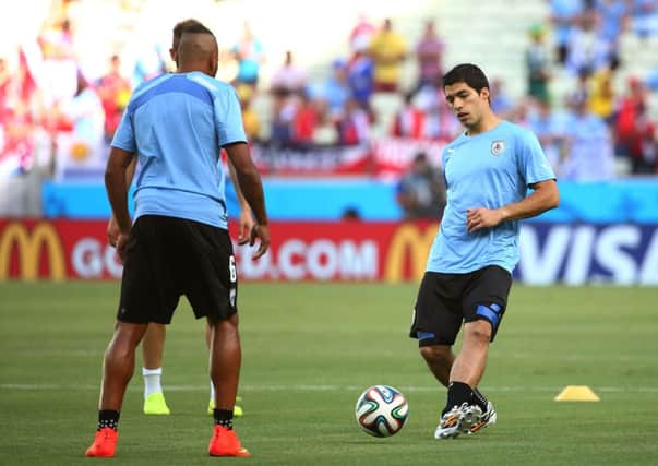 Luis Suarez, right, trains prior to Uruguay's game against Costa Rica. Picture: Getty