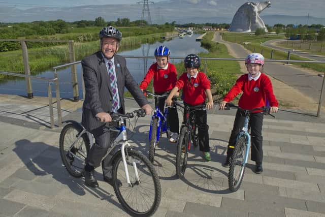 Keith Brown with P5 pupils(l to right) Tom Speirs, Kyle Symon & Ellie Hunter from Bowhouse Primary School. Picture: contributed