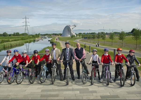 Transport Minister Keith Brown got on his bike at the Helix today to mark the opening of the new towpath. Picture: contributed