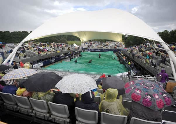 Rain stopped play during the match between John McEnroe and Mikael Pernfors at the tournament last year. Picture: TSPL