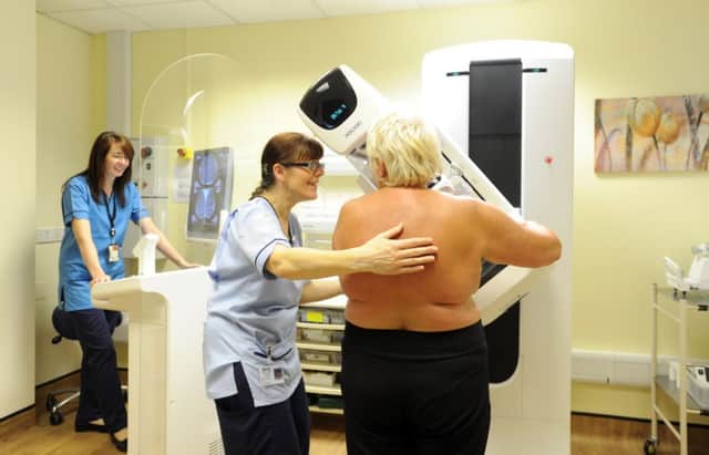 A patient being screened for breast cancer. Picture: Jane Barlow
