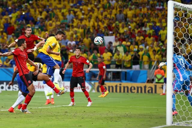 Guillermo Ochoa of Mexico makes a save after a header by Thiago Silva of Brazil. Picture: Getty