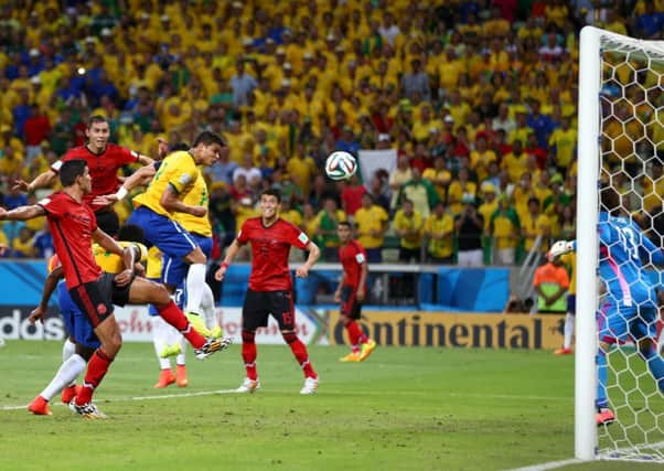 Guillermo Ochoa of Mexico makes a save after a header by Thiago Silva of Brazil. Picture: Getty