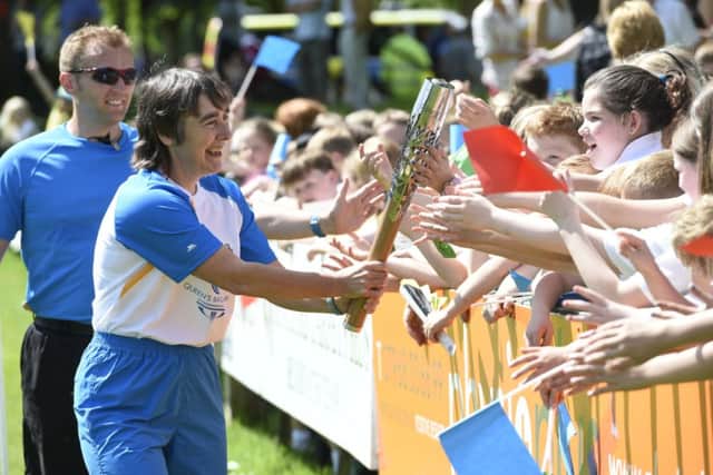 Batonbearer Jane Sargent carries the Glasgow 2014 Queen's Baton through Melrose. Picture: Getty