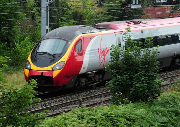 Virgin Trains has pledged to work towards cutting its Scotland-London route to under four hours. Picture: PA