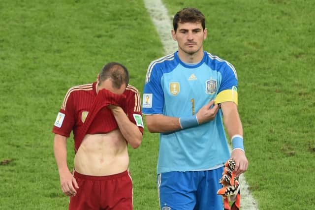 Andres Iniesta and Iker Casillas feel the pain. Picture: Getty Images