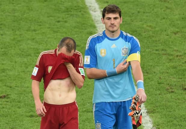 Andres Iniesta and Iker Casillas feel the pain. Picture: Getty Images