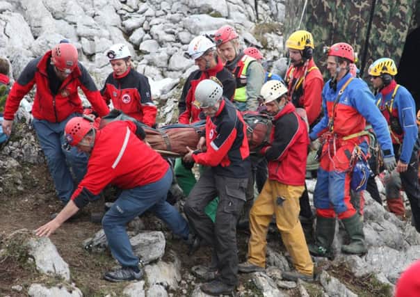 Rescuers carry Johann Westhauser out of the massive Riesending cave network on a stretcher. Picture: Getty