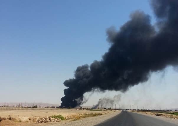A column of smoke rises from Beiji oil refinery, some 155 miles north of Baghdad. Picture: AP