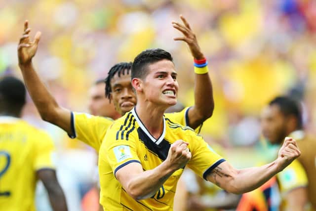 James Rodriguez of Colombia celebrates after scoring his team's first goal against the Ivory Coast. Picture: Getty