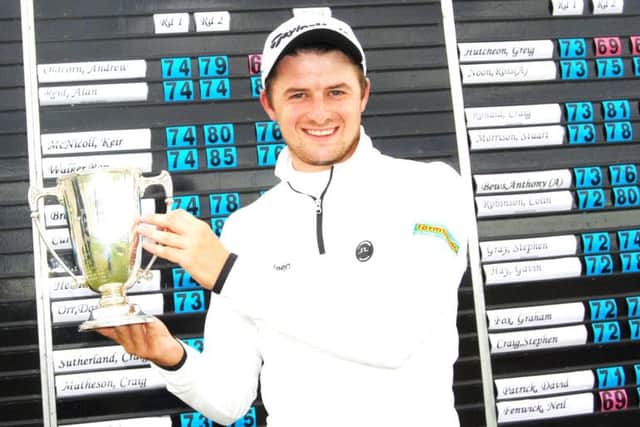 David Law lifts the trophy after winning the Northern Open at Murcar Links. Picture: Colin Farquharson