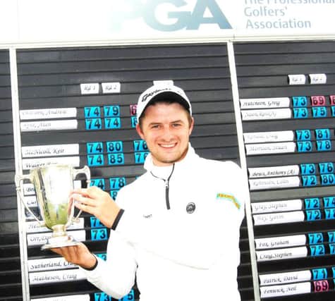 David Law lifts the trophy after winning the Northern Open at Murcar Links. Picture: Colin Farquharson