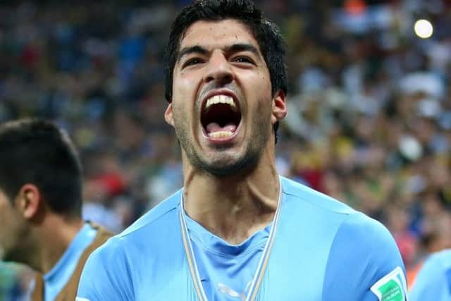 Luis Suarez celebrates his winner against England in Sao Paulo last night. Picture: Julian Finney/Getty Images