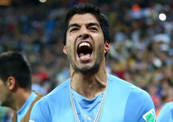 Luis Suarez celebrates his winner against England in Sao Paulo last night. Picture: Julian Finney/Getty Images