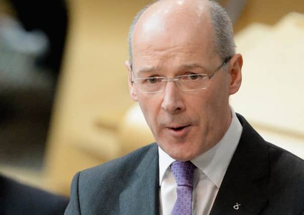 Iain Swinney: cearcall beusach. Picture: Getty
