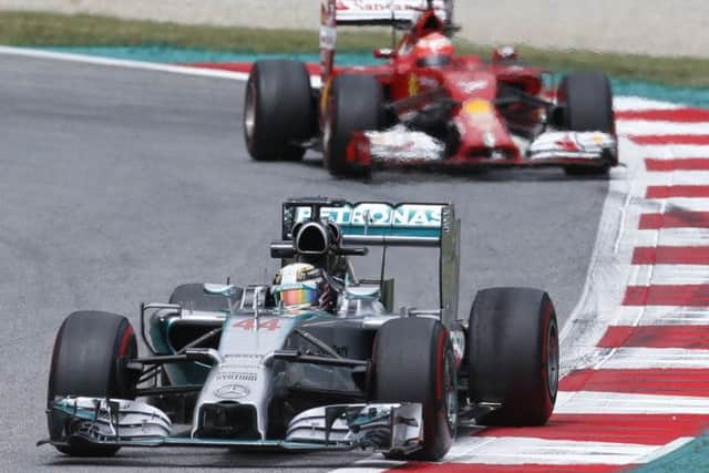 Lewis Hamilton sets the pace in front of Kimi Raikkonen during the practice. Picture: AP