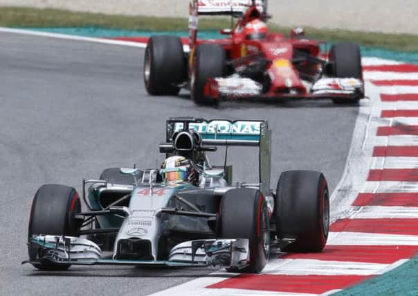 Lewis Hamilton sets the pace in front of Kimi Raikkonen during the practice. Picture: AP