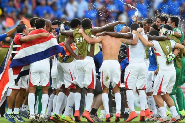 Costa Rica celebrate defeating Italy 1-0, a result that meant England are out of the tournament and Italy face a tough match to progress. Picture: Getty