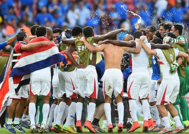 Costa Rica celebrate defeating Italy 1-0, a result that meant England are out of the tournament and Italy face a tough match to progress. Picture: Getty