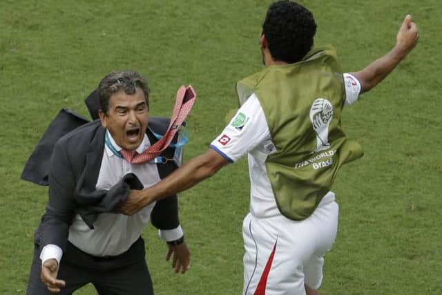 Costa Rica's head coach Jorge Luis Pinto, left, celebrates after winning 1-0 against Italy. Picture: AP