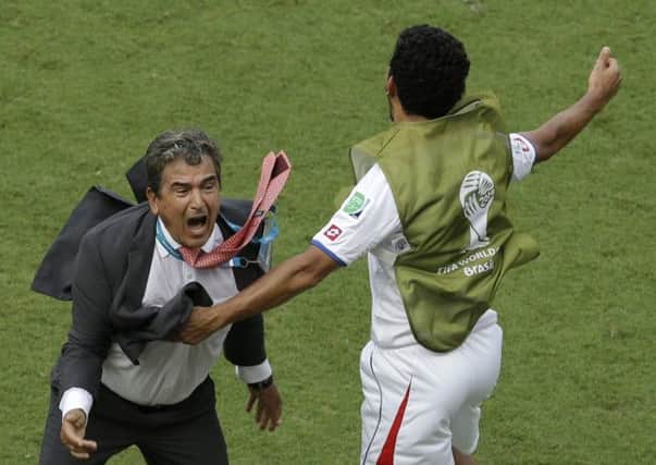 Costa Rica's head coach Jorge Luis Pinto, left, celebrates after winning 1-0 against Italy. Picture: AP