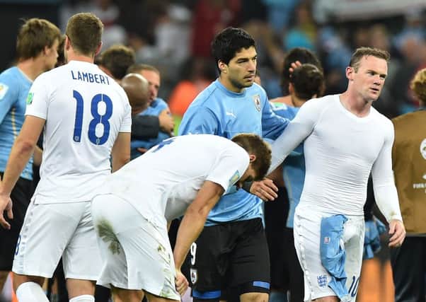 Englands players were left crestfallen after Luis Suarezs double for Uruguay on Thursday. Picture: PA