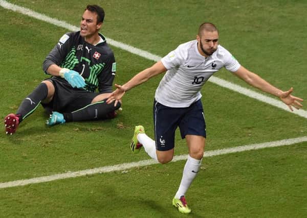 France striker Karim Benzema celebrates after scoring his sides fourth goal against Switzerland. Picture: Getty