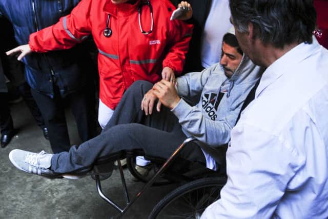 King Luis: Suarez excelled against England despite undergoing knee surgery a mere four weeks ago. Picture: AP
