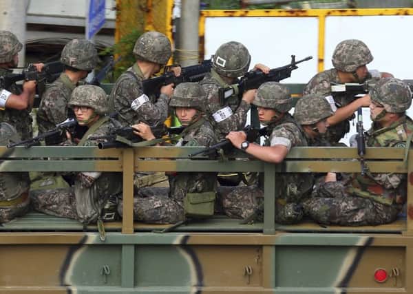 Heavily armed troops are being deployed in the border region in the hunt for the rogue South Korean soldier. Picture: Reuters