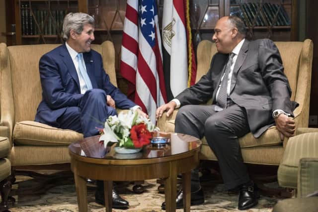 John Kerry met with Egypts foreign minister, Sameh Hassan Shoukry, before going on for talks with the countrys leader. Picture: AP