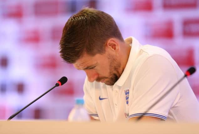 Steven Gerrard told a packed press conference that every England player was hurting after their early World Cup exit. Picture: PA