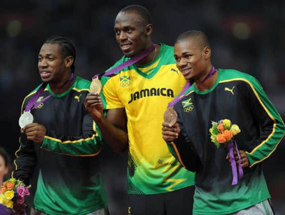 Yohan Blake, left, with Usain Bolt and Warren Weir on the podium at London 2012. Picture: Ian Rutherford