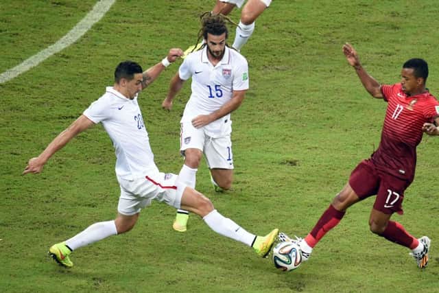 Nani vies for the ball with US defender Geoff Cameron. Picture: Getty