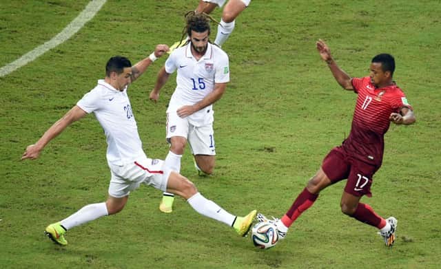 Nani vies for the ball with US defender Geoff Cameron. Picture: Getty