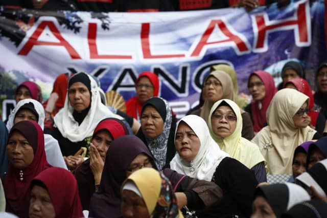 Muslim women take part in a protest outside the Court of Appeal. Picture: Vincent Thian/AP