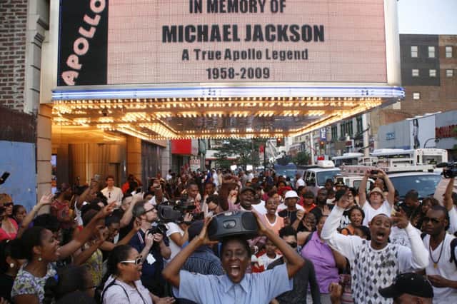 On this day in 2009 music fans gathered outside a New York theatre on hearing that pop superstar Michael Jackson had died. Picture: Getty