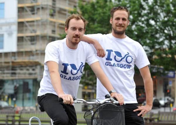 NextBike's Robert Grisdale, left, and Sebastian Schlebusch try out the new bikes in Glasgow's George Square. Picture: Hemedia