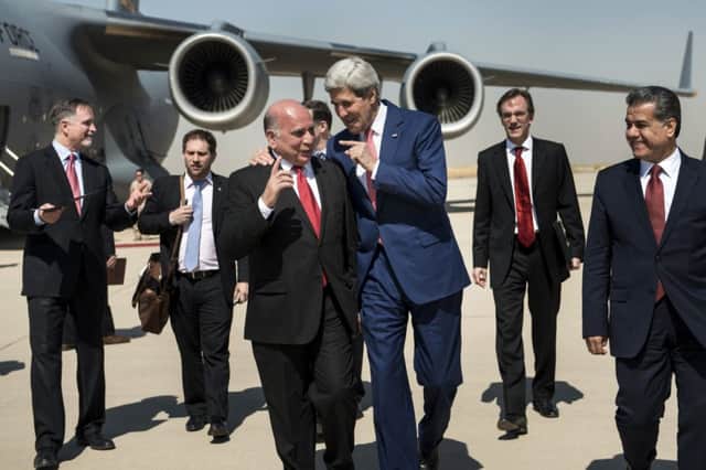 John Kerry talks with a Kurdish government official in Irbil. Picture: AP