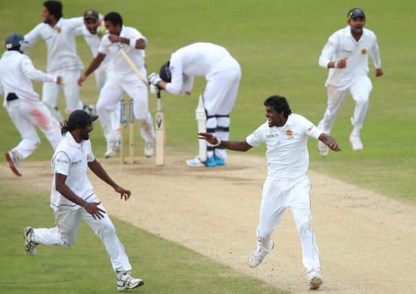 Sri Lankas Shaminda Eranga, right, shows his joy at taking the wicket of James Anderson. Picture: Getty