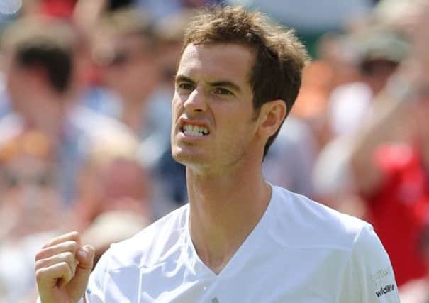 Andy Murray celebrates defeating Slovenia's Blaz Rola during day three. Picture: PA