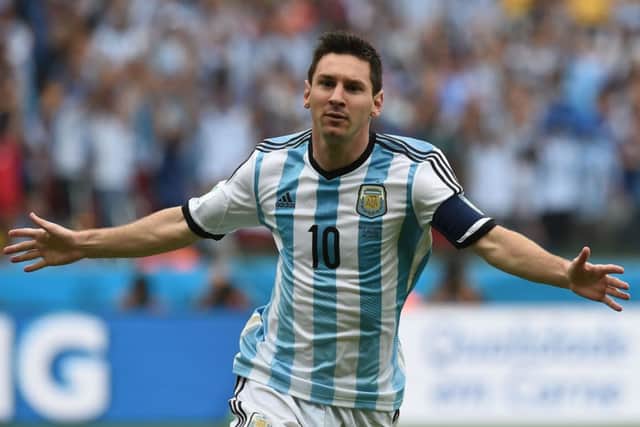 Lionel Messi wheels away in delight after scoring against Nigeria. Picture: Getty