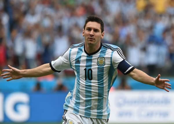 Lionel Messi wheels away in delight after scoring against Nigeria. Picture: Getty
