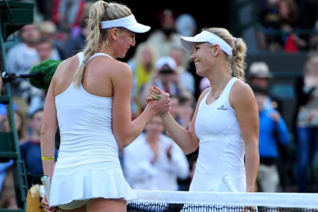 Britains Naomi Broady, left, congratulates her conqueror Caroline Wozniacki of Denmark. Picture: Ian Rutherford