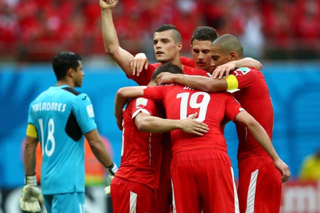 Xherdan Shaqiri of Switzerland celebrates with teammates scoring his team's third goal. Picture: Getty